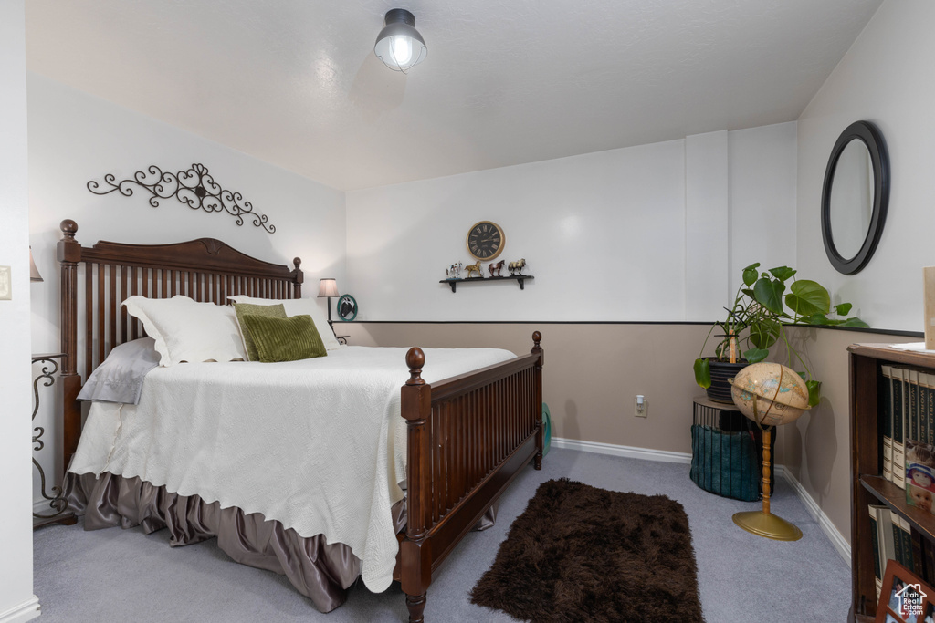 Bedroom with carpet flooring and baseboards