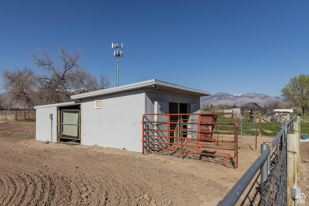 View of outbuilding featuring an exterior structure, an outbuilding, and a mountain view