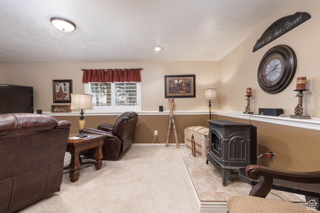 Carpeted living area featuring baseboards