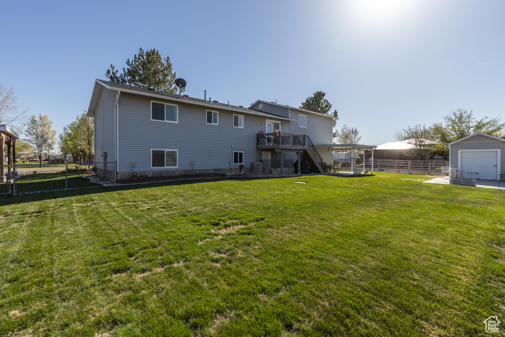 Back of house featuring stairway and a wooden deck