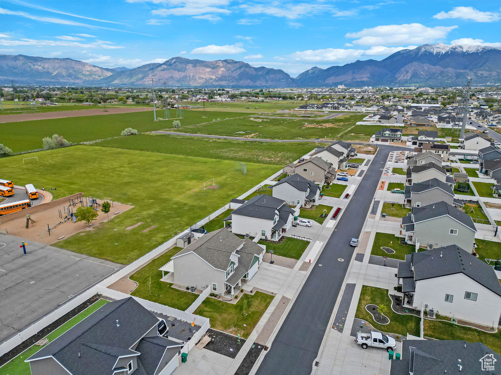 Aerial view of residential area featuring mountains