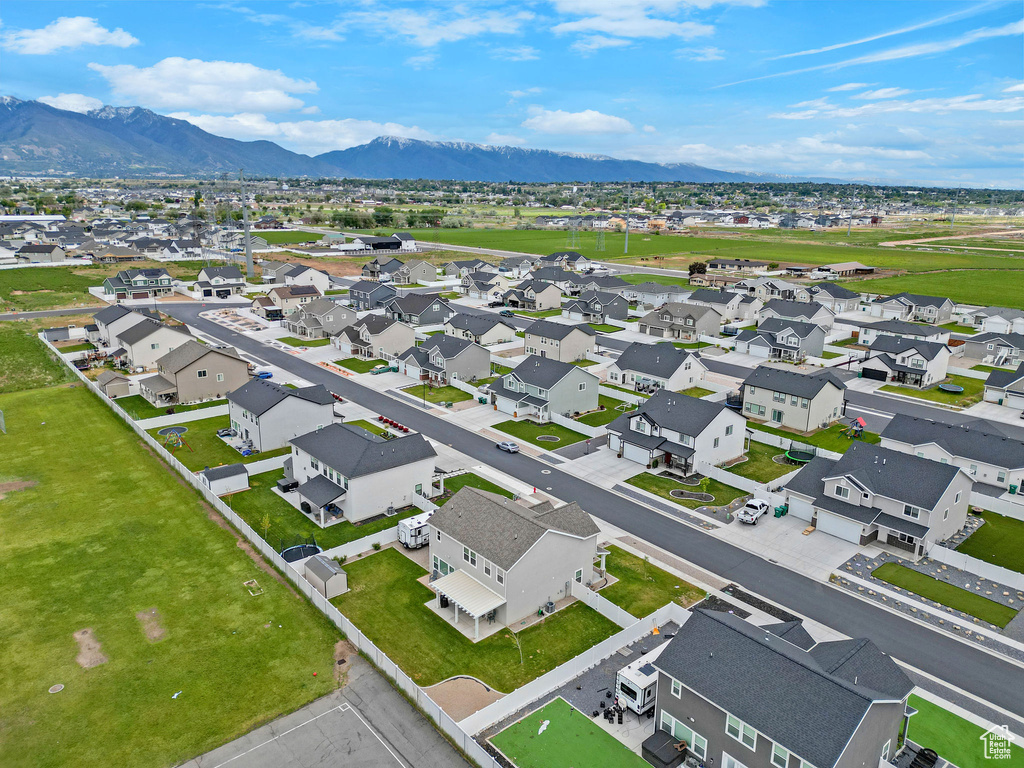 Aerial view of residential area featuring a mountain backdrop