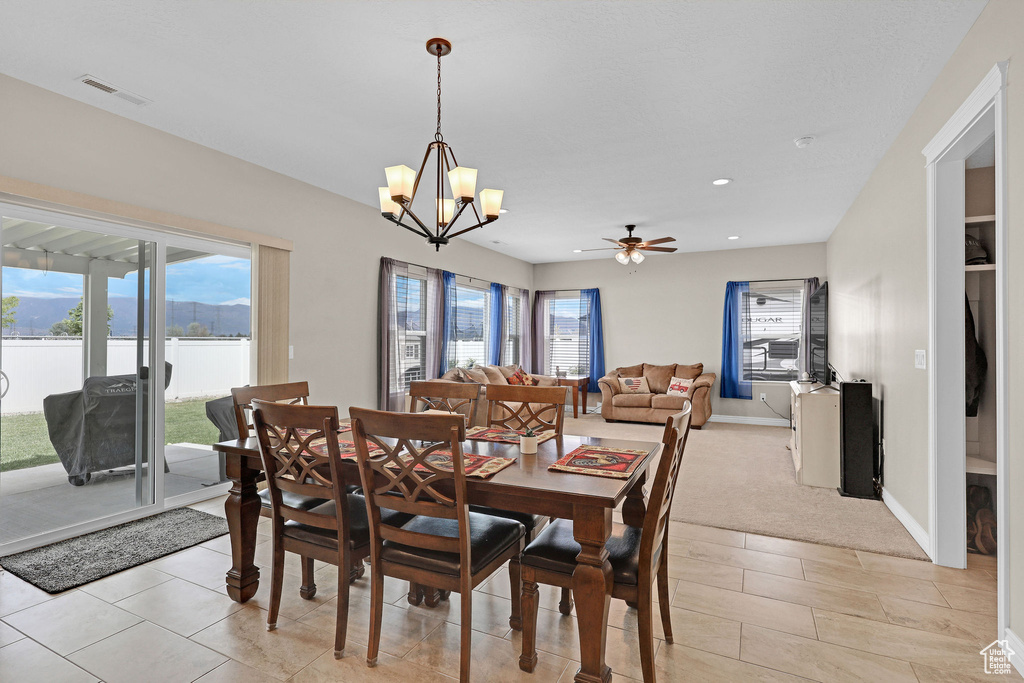 Dining area with a chandelier, ceiling fan, recessed lighting, and baseboards