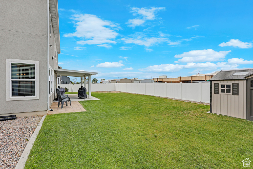 View of yard with a patio area