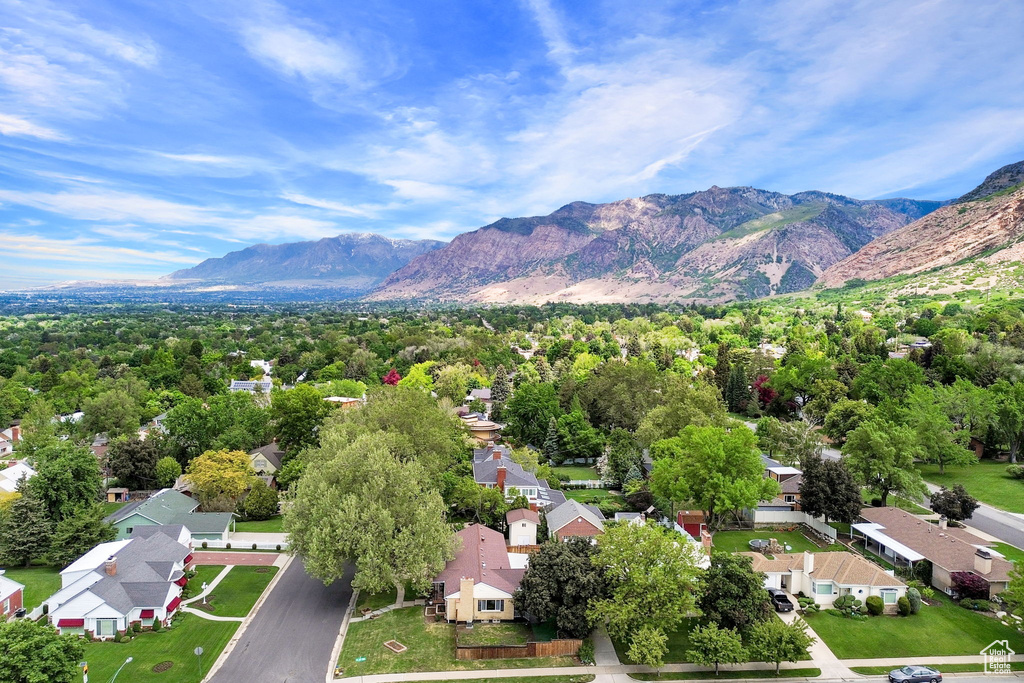 Aerial view of residential area featuring a mountainous background