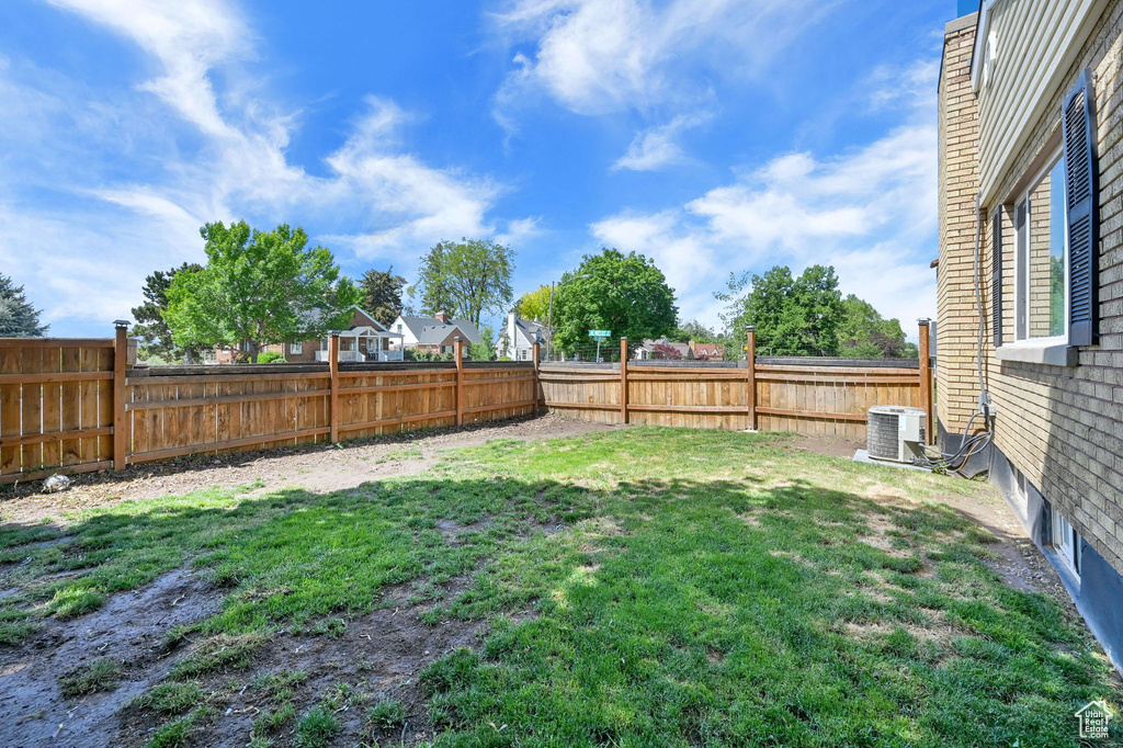 View of yard with central AC unit