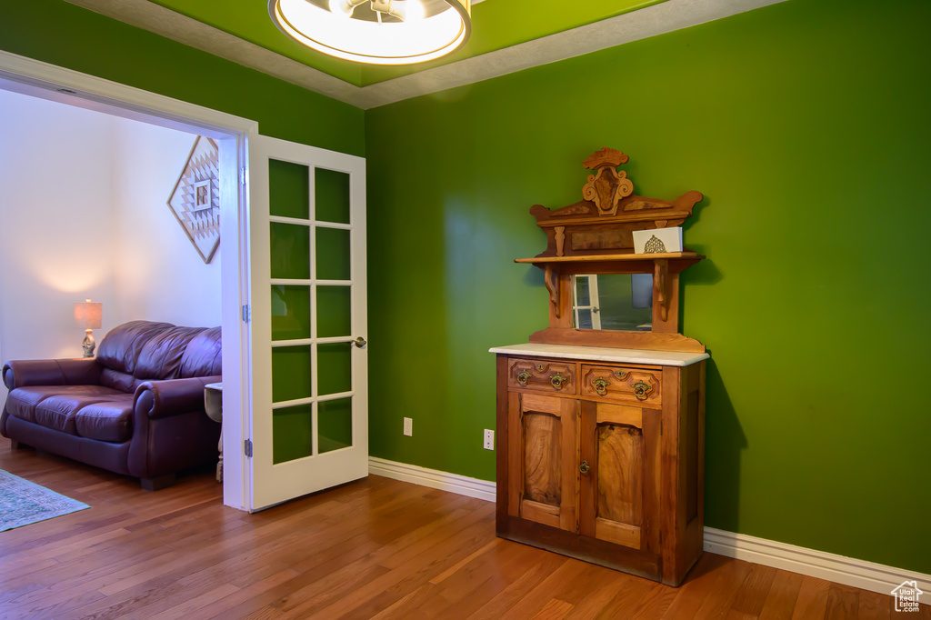 Office with wood finished floors and baseboards