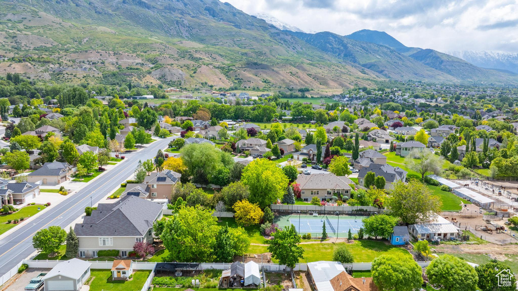 Aerial perspective of suburban area with a mountain backdrop