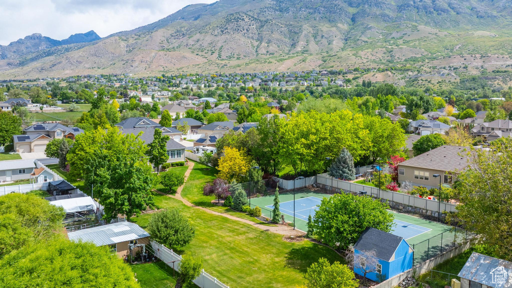 Aerial perspective of suburban area featuring a mountain backdrop