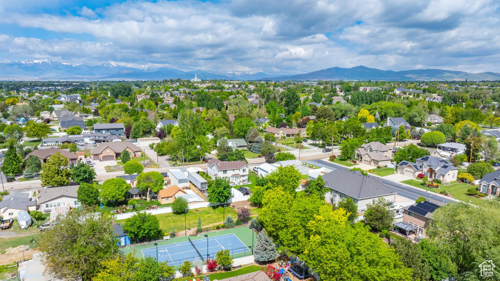 Aerial perspective of suburban area with a mountain backdrop