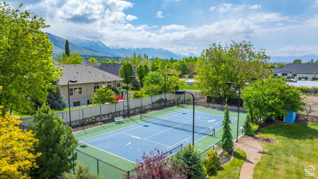 View of tennis court featuring a mountain view