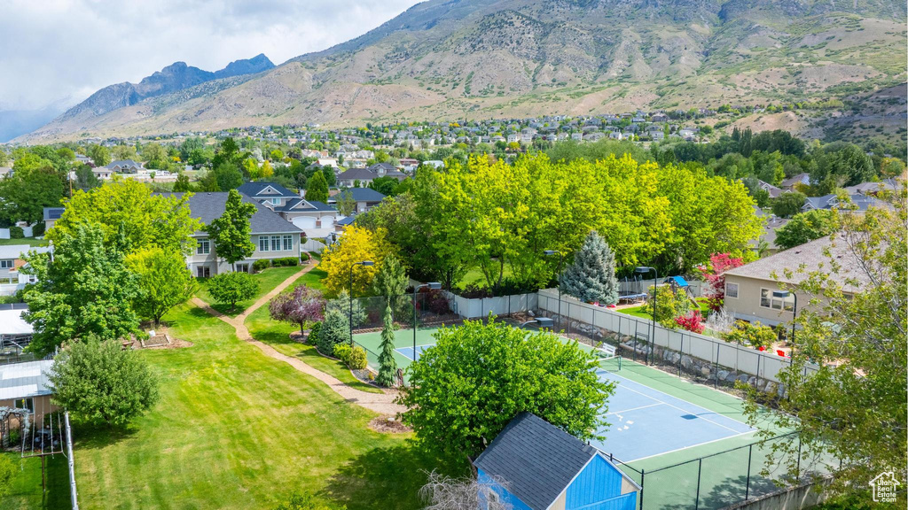 Aerial view of residential area featuring a mountainous background