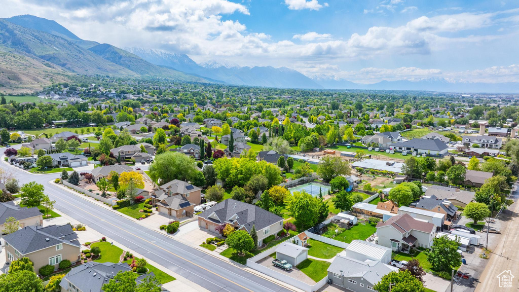 Aerial view of residential area featuring a mountainous background