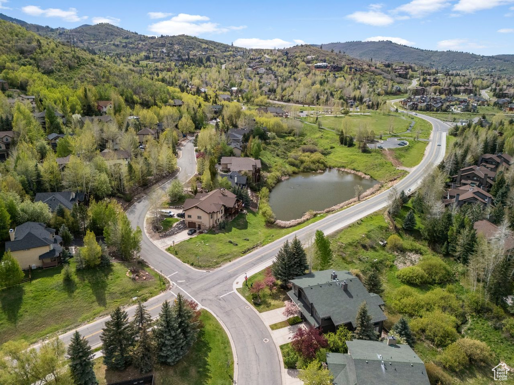 Aerial view of property\'s location featuring mountains and nearby suburban area
