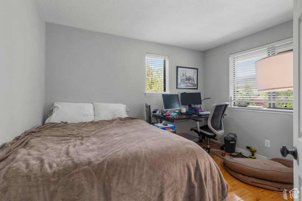 Bedroom with wood finished floors