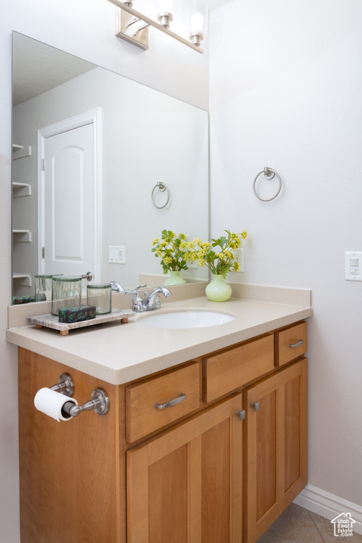 Bathroom with vanity and tile patterned floors