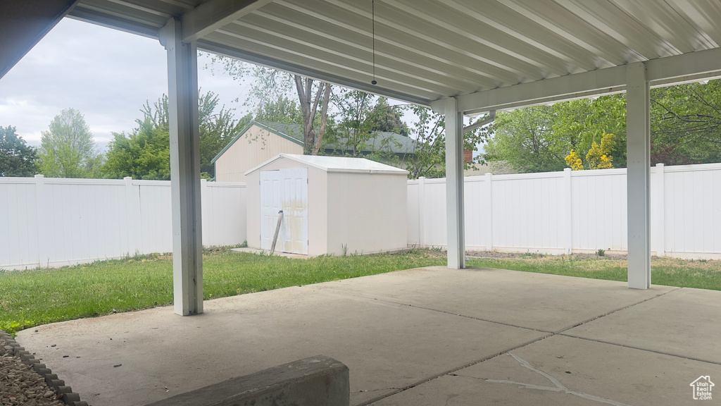 Fenced backyard featuring a patio