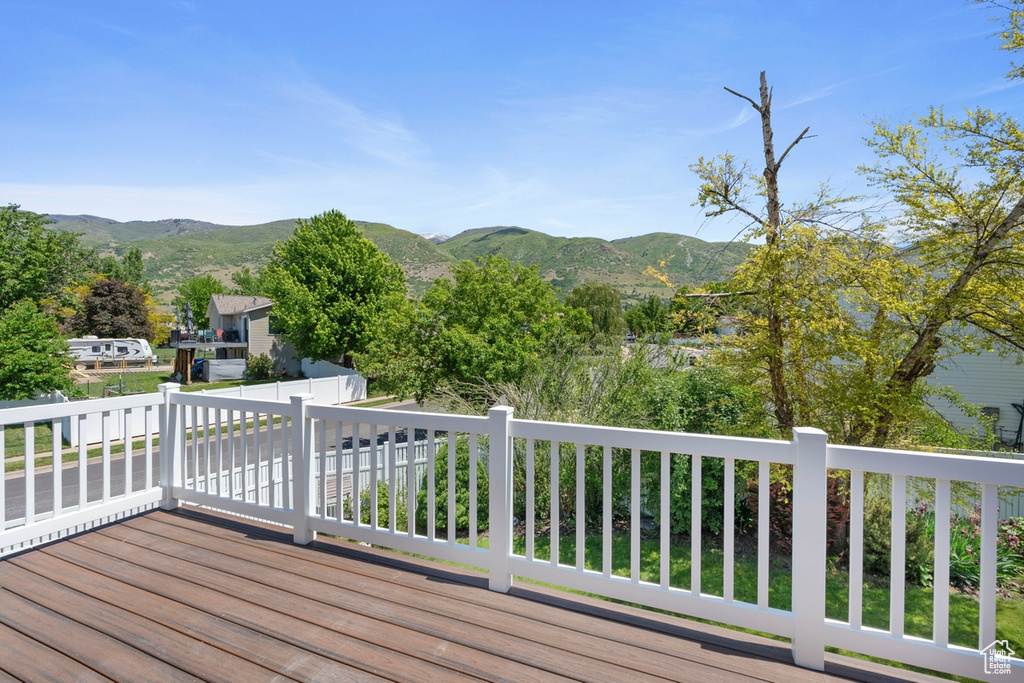 Wooden terrace featuring a mountain view