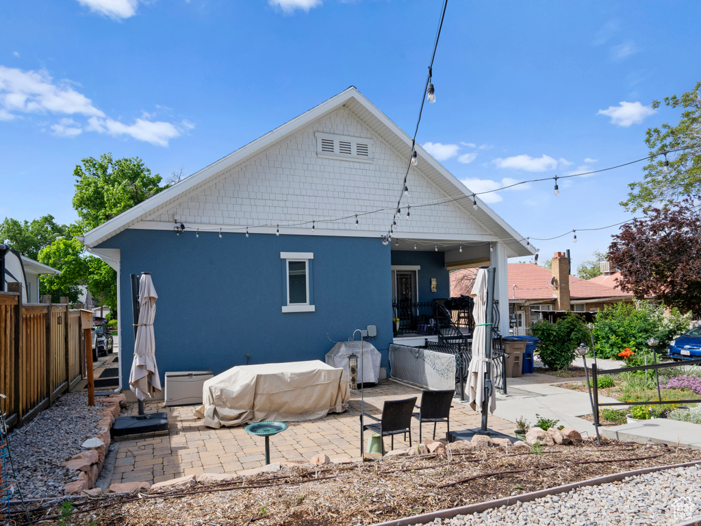 Rear view of house featuring a patio and stucco siding