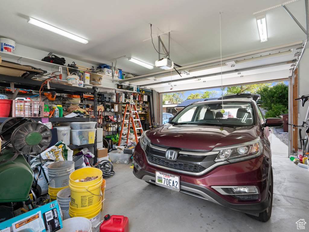 Garage featuring a garage door opener