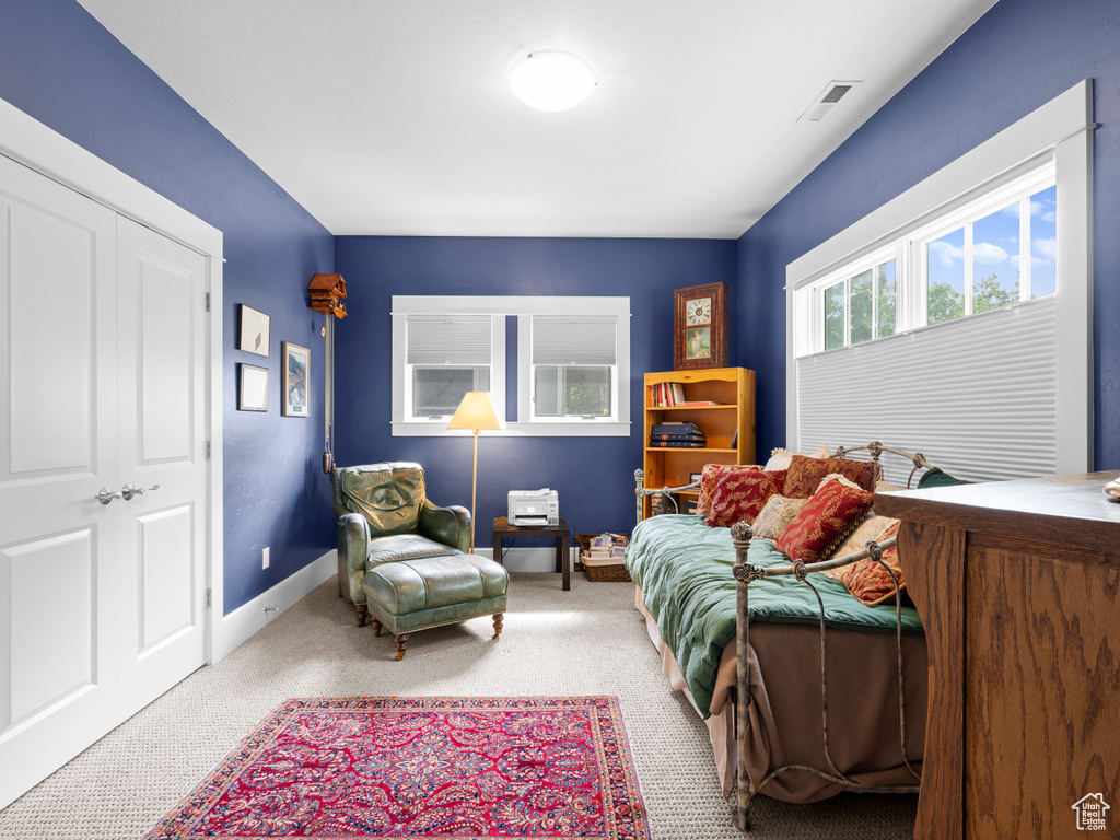 Carpeted bedroom with baseboards