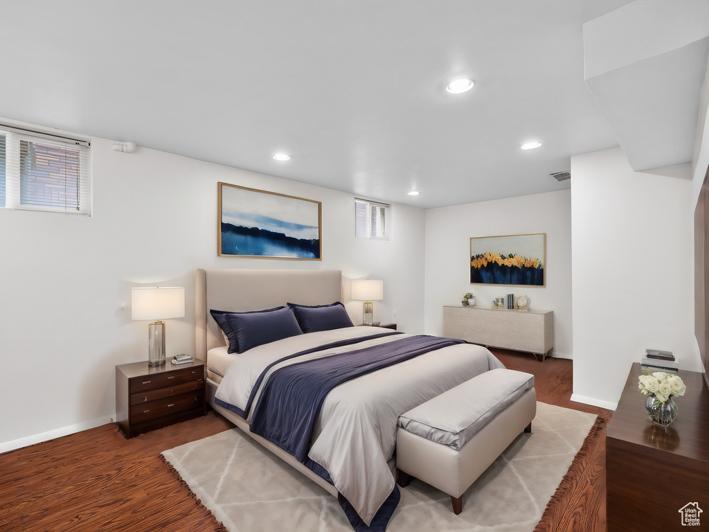 Bedroom featuring wood finished floors, baseboards, and recessed lighting
