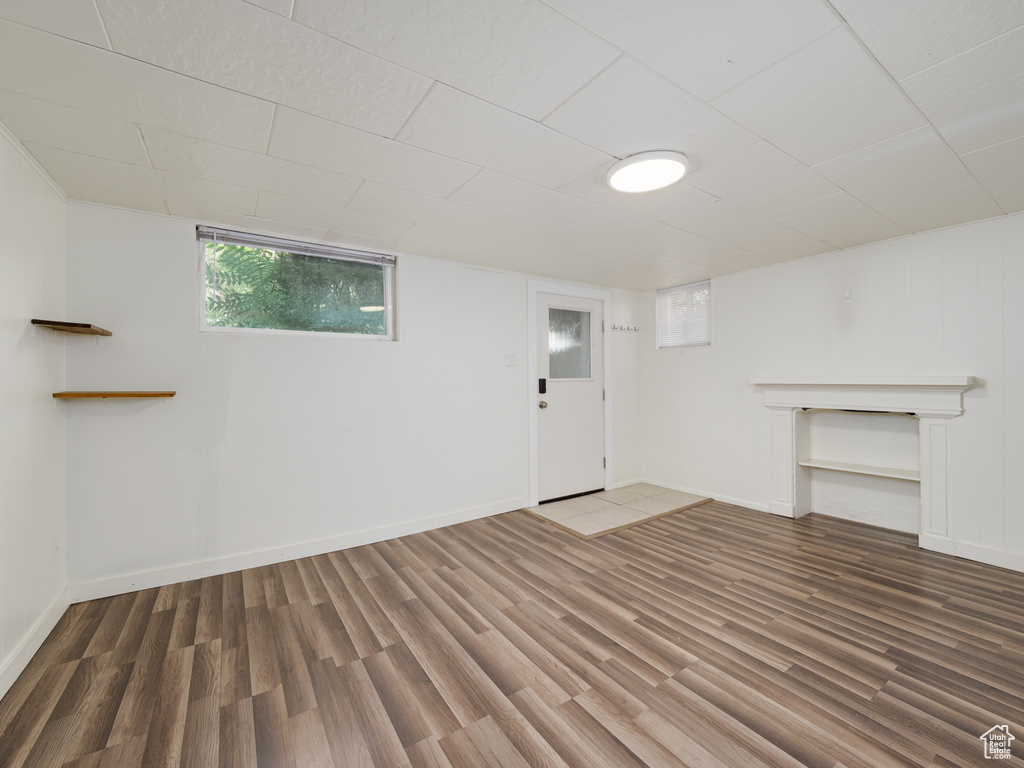 Basement with wood finished floors and baseboards