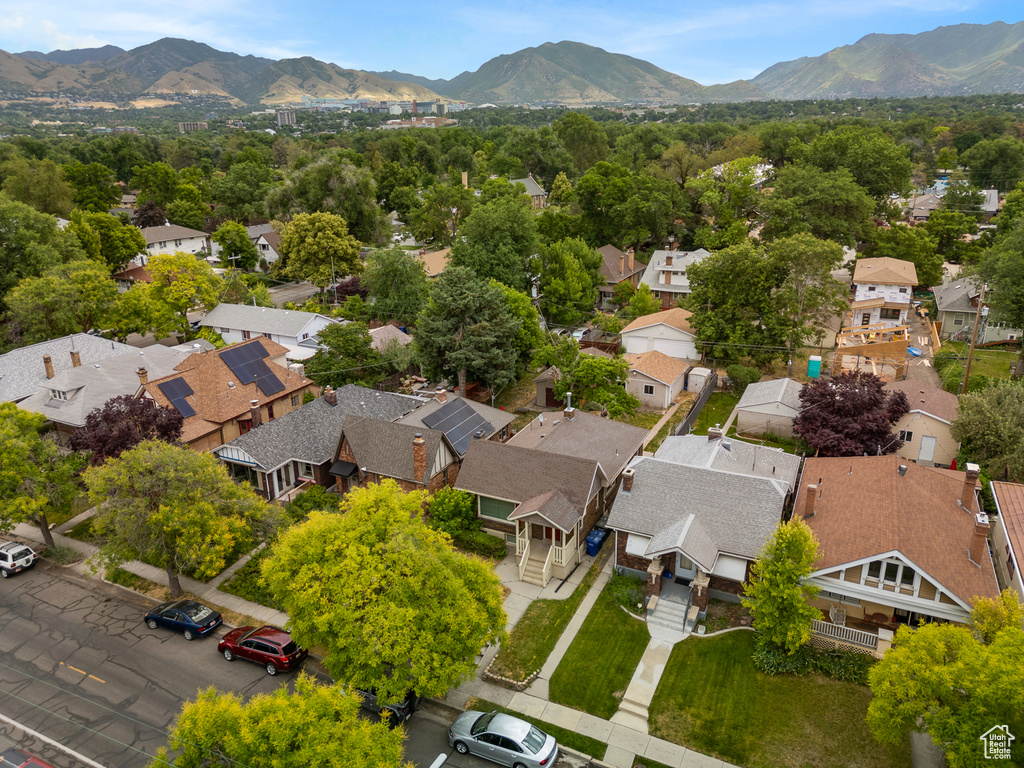 Aerial perspective of suburban area with a mountain backdrop