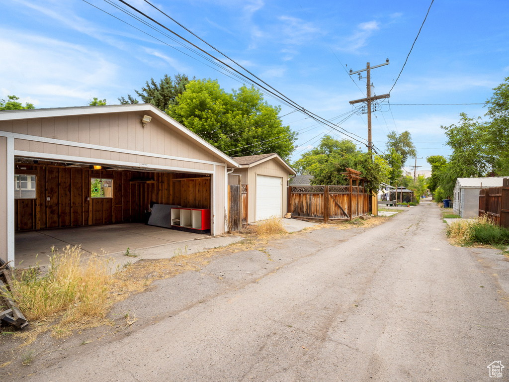 Detached garage featuring fence
