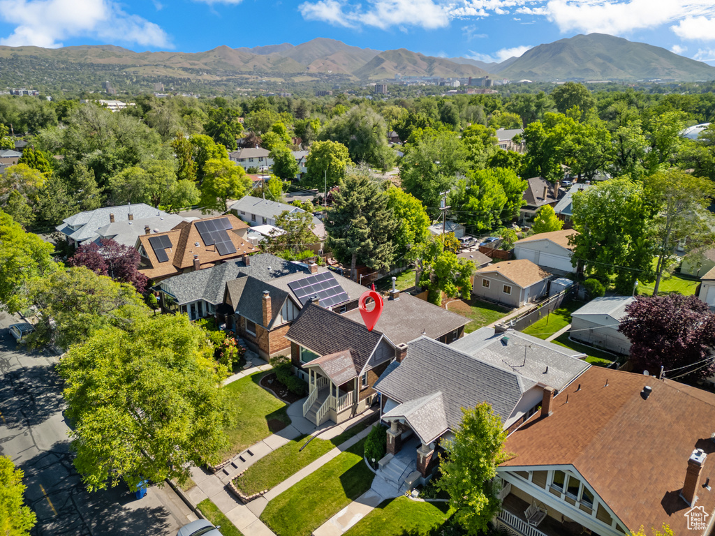 Aerial perspective of suburban area featuring a mountain backdrop