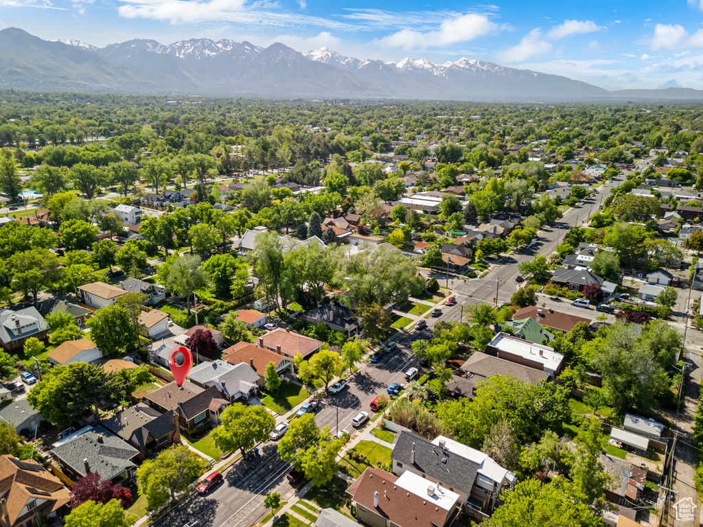 Aerial perspective of suburban area featuring a mountainous background