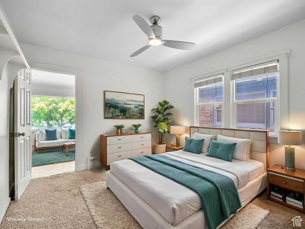Bedroom with ceiling fan and arched walkways