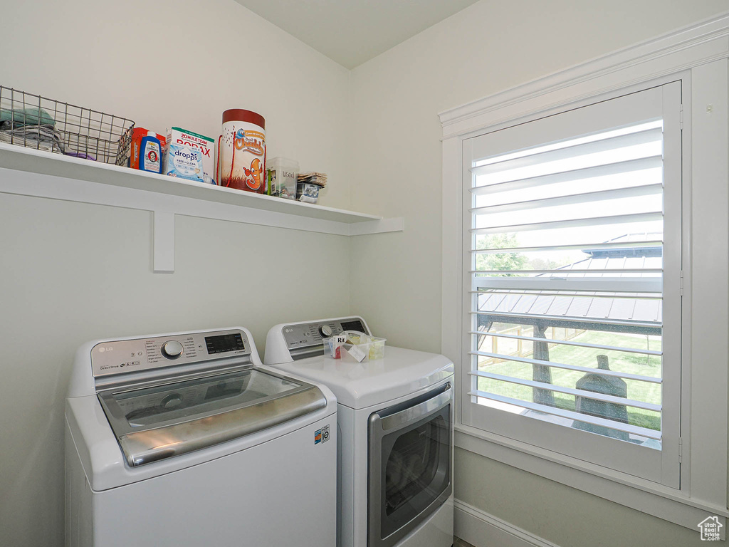 Laundry area featuring separate washer and dryer