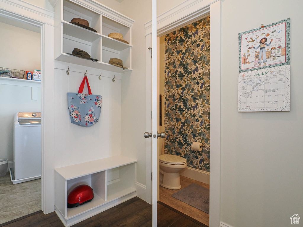 Mudroom featuring washer / dryer, dark wood-style flooring, and baseboards