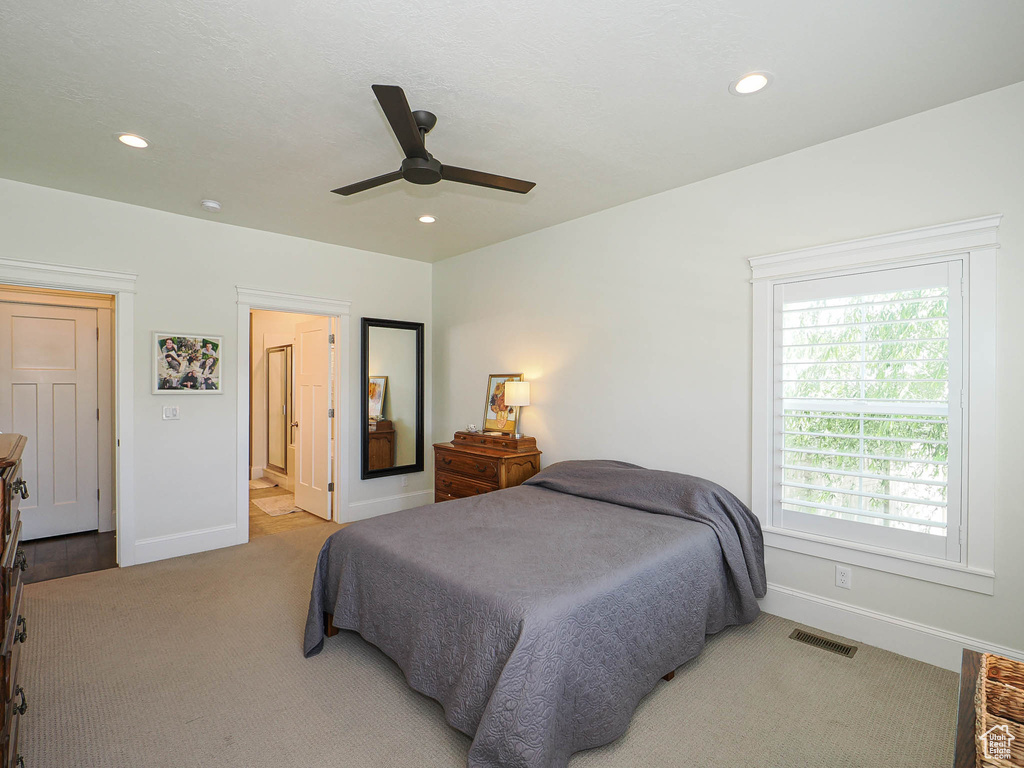 Bedroom featuring baseboards, carpet, recessed lighting, ceiling fan, and connected bathroom