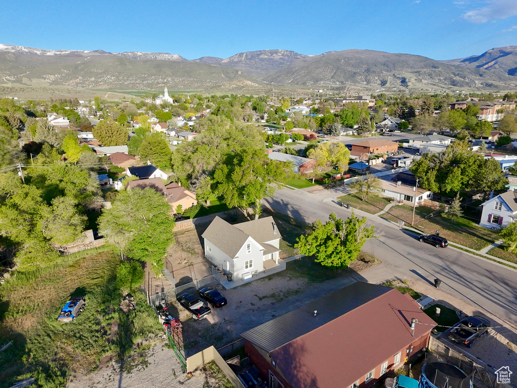 Aerial view of residential area featuring a mountain backdrop