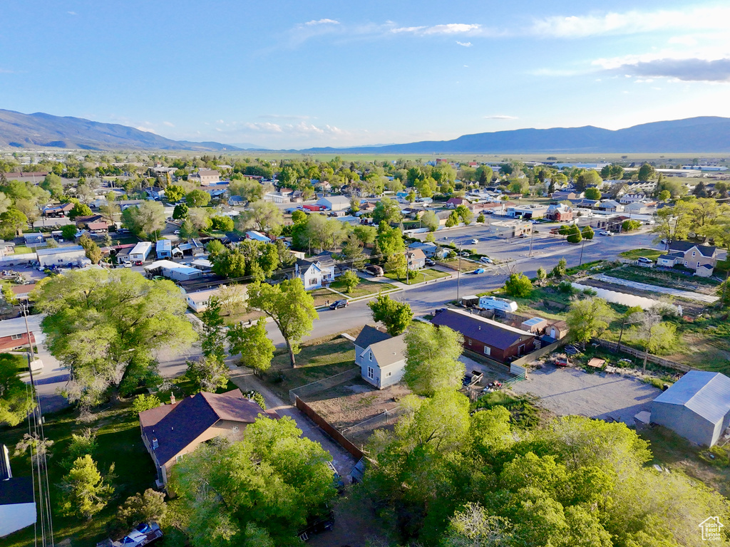 View of property location featuring a mountain backdrop and nearby suburban area