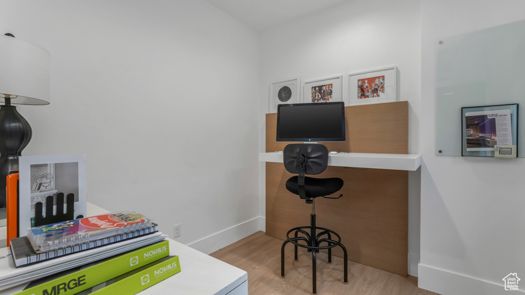 Office area featuring wood finished floors and baseboards