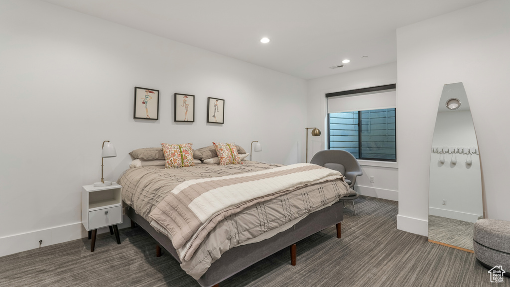 Bedroom featuring recessed lighting, carpet, and baseboards