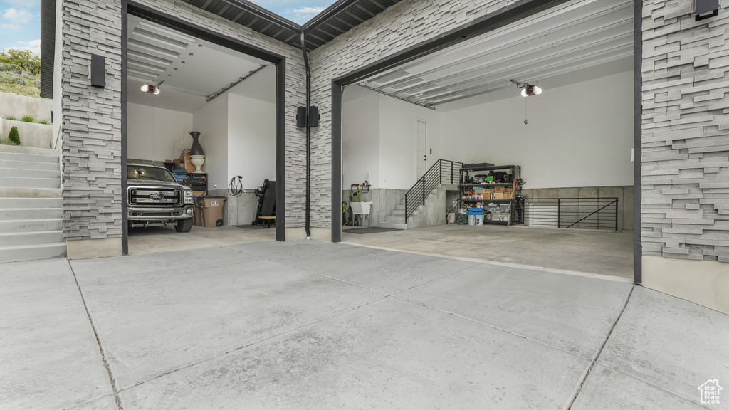 Garage featuring concrete driveway