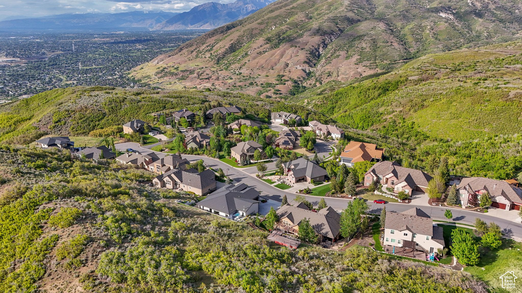 View of property location featuring nearby suburban area and a mountainous background