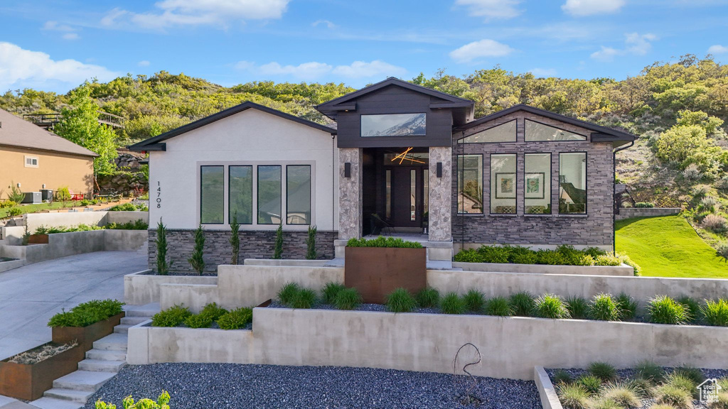 Modern home with stone siding