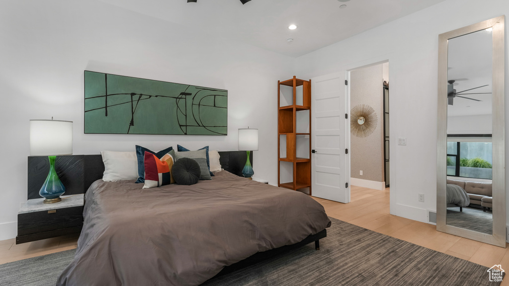 Bedroom featuring wood finished floors, baseboards, and recessed lighting