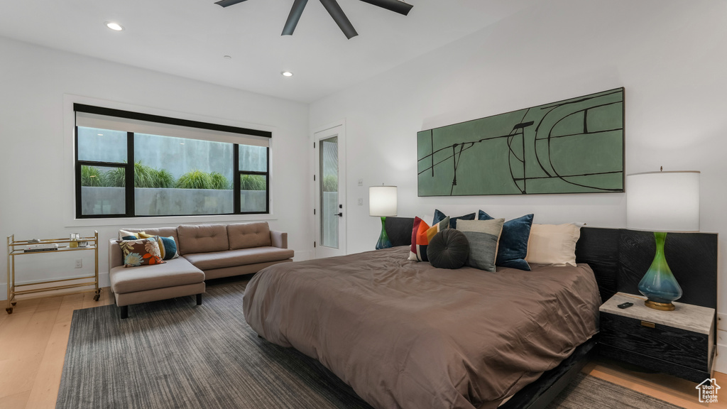 Bedroom with wood finished floors, recessed lighting, and a ceiling fan