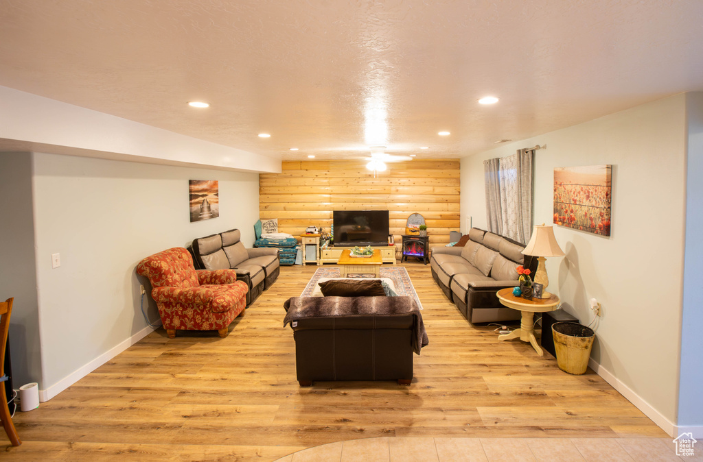 Living area featuring recessed lighting, light wood-type flooring, and baseboards