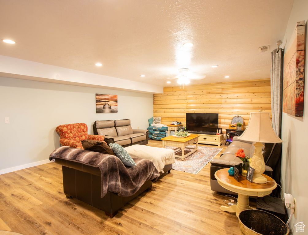 Living area featuring recessed lighting, light wood-type flooring, and baseboards