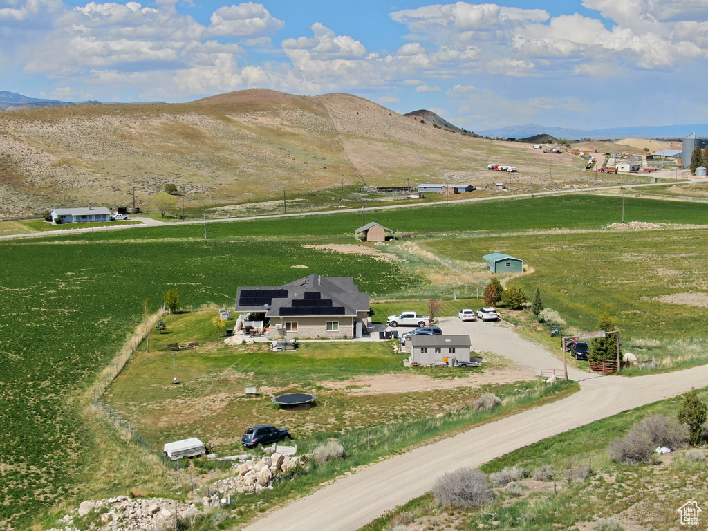 Aerial view of sparsely populated area with a mountain backdrop