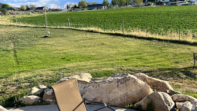 View of yard with a view of countryside