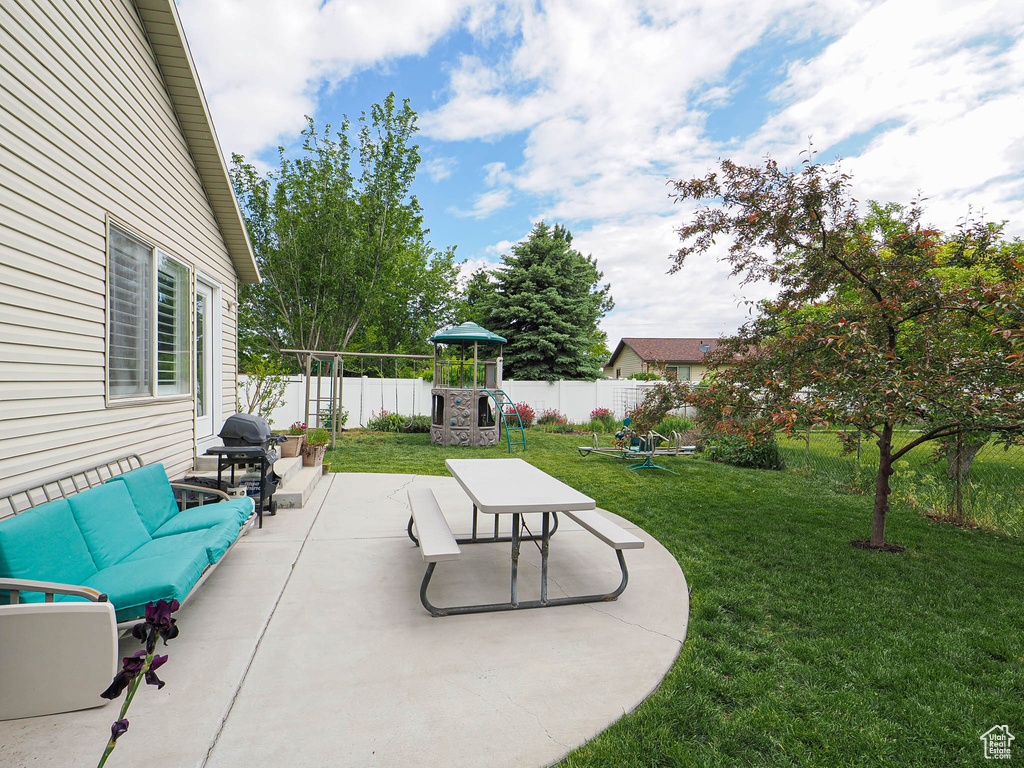 View of patio / terrace with grilling area and an outdoor hangout area