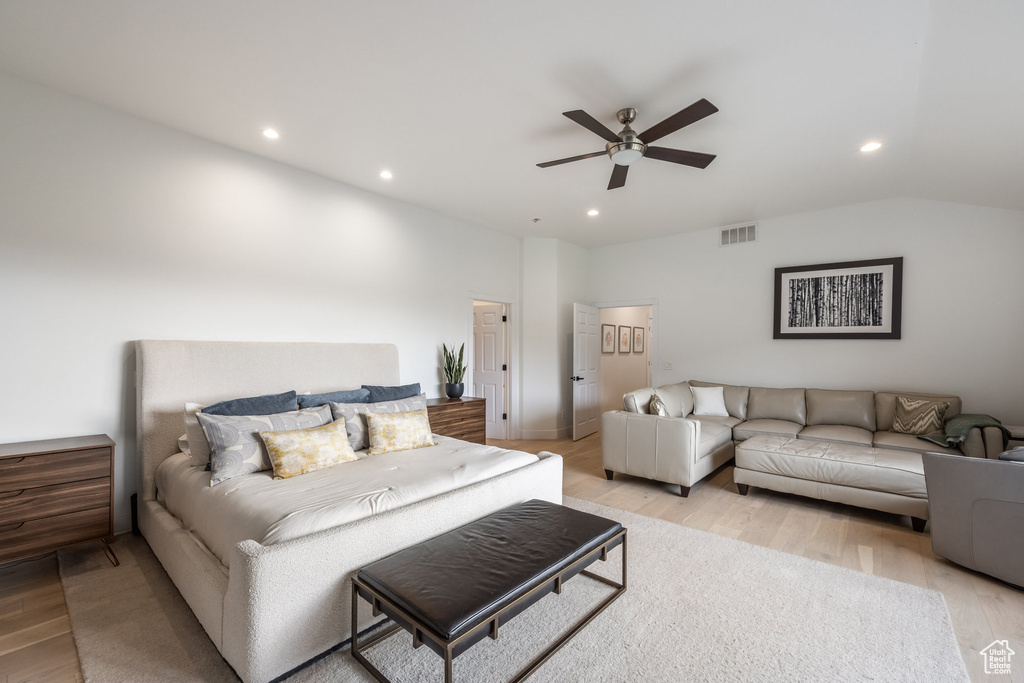 Bedroom with light wood-style floors, recessed lighting, ceiling fan, and vaulted ceiling